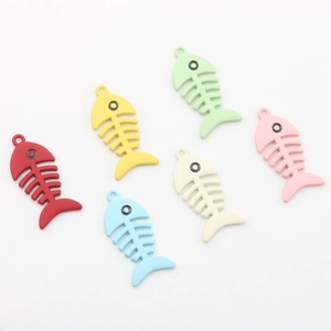 Macro view of six colorful matte fishbone charms for DIY jewelry making accessories