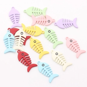 Detailed macro view of colorful fish bone alloy charms with matte spray paint finish