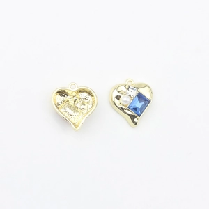 Detailed front and back view of gold heart pendants with blue gem and pearl inlay