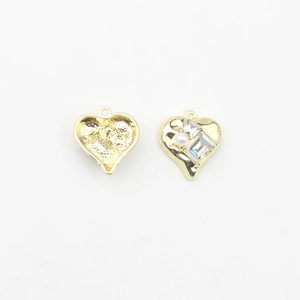 Detail of gold heart pendant charm with pearl and cubic zirconia for DIY jewelry