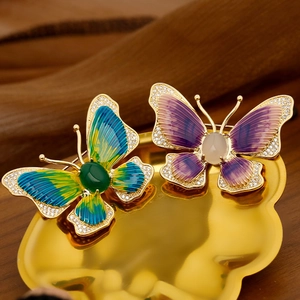 Luxury butterfly brooches with enamel gradient wings and gold metal plating in a tray
