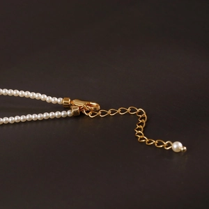 Elegant 2mm pearl necklace with golden lobster clasp and adjustable extension chain