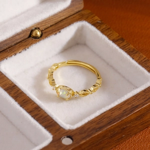 French luxury gold opal ring with diamond accents and vintage carved adjustable band