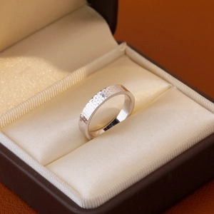 Minimalist silver ring with hammered texture in jewelry box for women