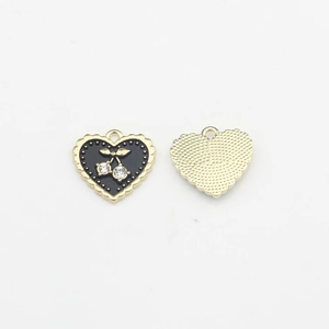 Detailed close-up of heart-shaped black enamel cherry pendant with sparkling zircons