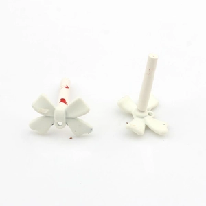 Detailed macro view of white matte resin bowknot DIY jewelry accessories components
