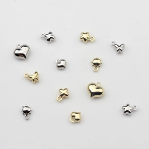 Mini dijes de aleación DIY con formas de corazón, estrella, mariposa y sol en oro y plata