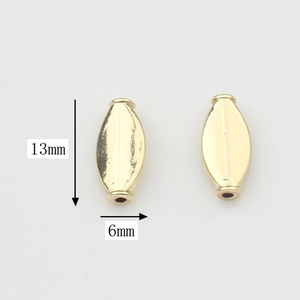 Detalle de cuentas de aleación doradas en forma de oliva 13x6mm para bisutería DIY