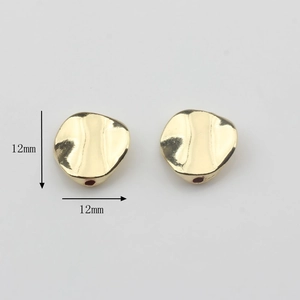 Foto macro de cuentas de aleación dorada ondulada de 12mm para accesorios de joyería