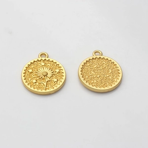 Detailed macro view of golden sunflower coin pendant with embossed details and textured back