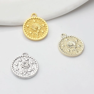 Floral coin pendants in gold, silver, and light gold with embossed sunflower and stars