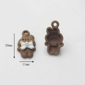 Detail view of brown resin bear charms for DIY jewelry making with dimensions 20x11mm