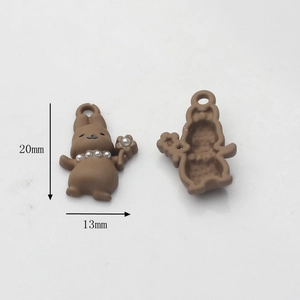 Detail showing 20mm x 13mm brown bunny charms with pearl accents for jewelry making