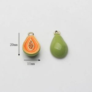 Detail view of papaya alloy pendants with orange enamel and gold trim, 20mm x 11mm size