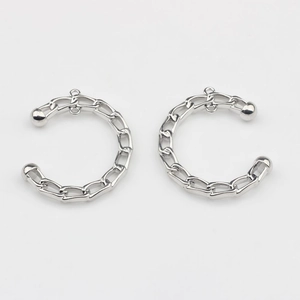 Detail of silver alloy C-shape chain link connectors for DIY earring making