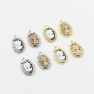 Vintage oval cameo pendants with bow and pearl detail for DIY jewelry making