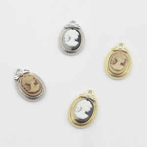 Vintage oval cameo charms with lady profile and pearl accents in gold and silver finish