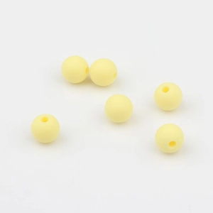 Detalle de cuentas redondas de silicona amarillo pálido de 9mm con agujeros para DIY