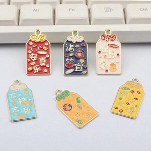 Set of 6 Chinese style enamel lucky charms with blessings on a modern keyboard background