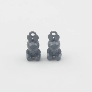 Close-up of cute grey rabbit charms for DIY jewelry making with smooth glossy finish