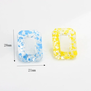Rectangular colorful resin chain links with blue and yellow paint splatter for DIY jewelry