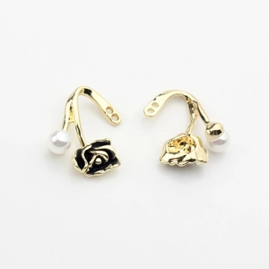 Detail of vintage flower and pearl earring charms for DIY jewelry making accessories