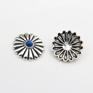 Detail of silver daisy conchos with blue resin center for DIY jewelry making