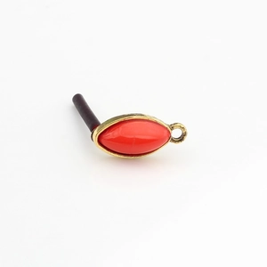 Macro detail of red marquise resin earring with gold metal frame and small hanging loop