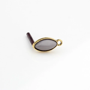 Detailed view of marquise resin charm in gold alloy setting for DIY jewelry making