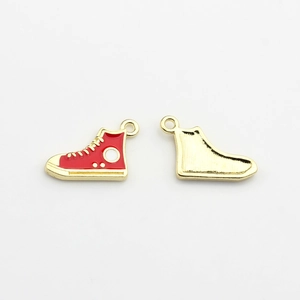 Detailed view of red enamel high-top sneaker charm with gold plated alloy finish