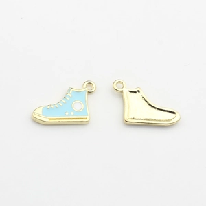 Detail of mini blue enamel high-top shoe charms with gold plated backs for DIY jewelry