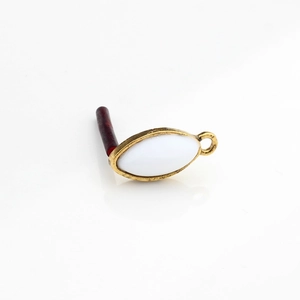 Macro detail of vintage gold alloy marquise resin earring charm for DIY jewelry making