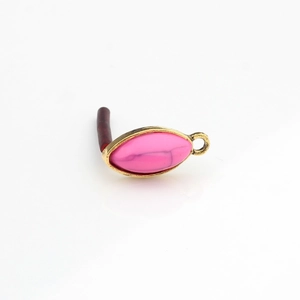 Macro detail of vintage pink marquise resin stone in gold alloy frame earring finding