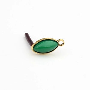 Detail of vintage marquise green resin stone in gold metal frame for DIY earring jewelry