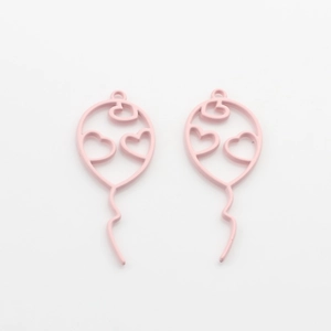 Close-up of pink heart balloon hollow charms for DIY jewelry making accessories