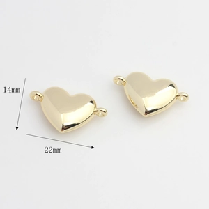 Detailed macro view showing a 22x14mm golden heart charm connector with dual rings