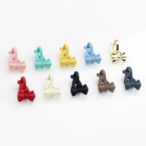 Colorful matte bow-shaped alloy charms for DIY jewelry making in ten vibrant paint colors