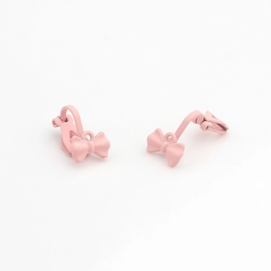 Detail view of pink matte bow clip-on earrings for DIY jewelry making and non-pierced ears