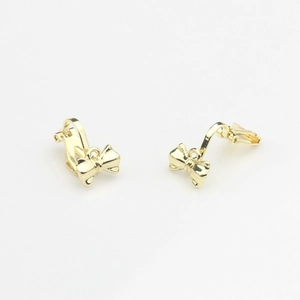 Detailed view of gold-polished alloy bow clip-on earrings for DIY jewelry making