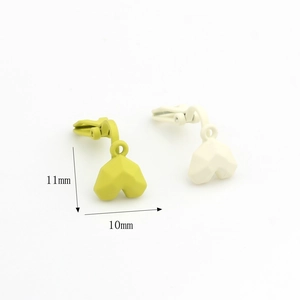 Minimalist 11mm matte heart charms in mustard yellow and off-white for DIY jewelry making