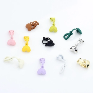 Colorful matte and metallic heart clip-on earrings set on a clean white background