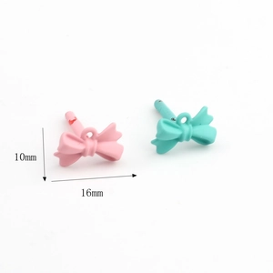 Matte finish pink and teal bow charms in 16mm size for DIY earring making supplies
