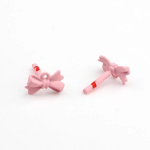 Detail of pink bow-knot jewelry accessory with painted alloy surface for DIY handmade earrings