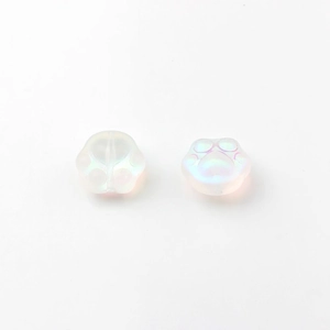 Macro detail of iridescent cat paw glass beads with rainbow shimmer for DIY jewelry