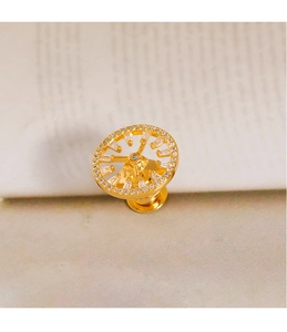Macro shot of gold geometric clock brooch with delicate micro-pave zircon crystals