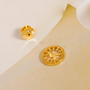 Elegant gold geometric clock brooch with hollow round disk and butterfly clasp
