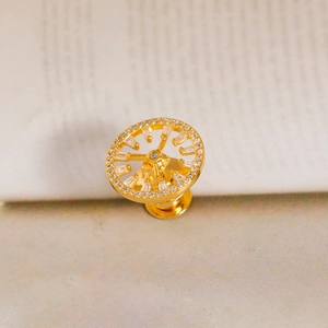 Elegant gold clock-shaped brooch with clear crystals and hollow geometric design