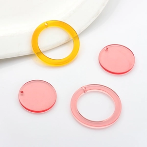 DIY colorful round resin earring charms for handmade jewelry making in pink and yellow