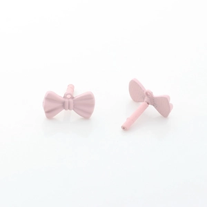 Detailed view of matte pink bow stud earrings with small ring and needle structure