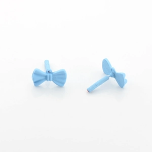 Close-up of light blue matte bow stud earrings showing front and side details